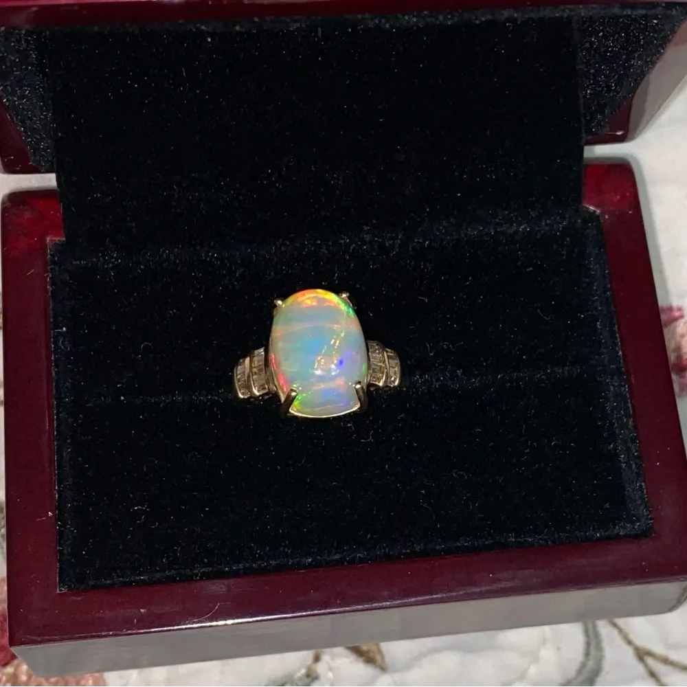 AAA Ethiopian Welo 7.56 cwt Opal and G-H SI Diamond Ring in 10 k gold size 7